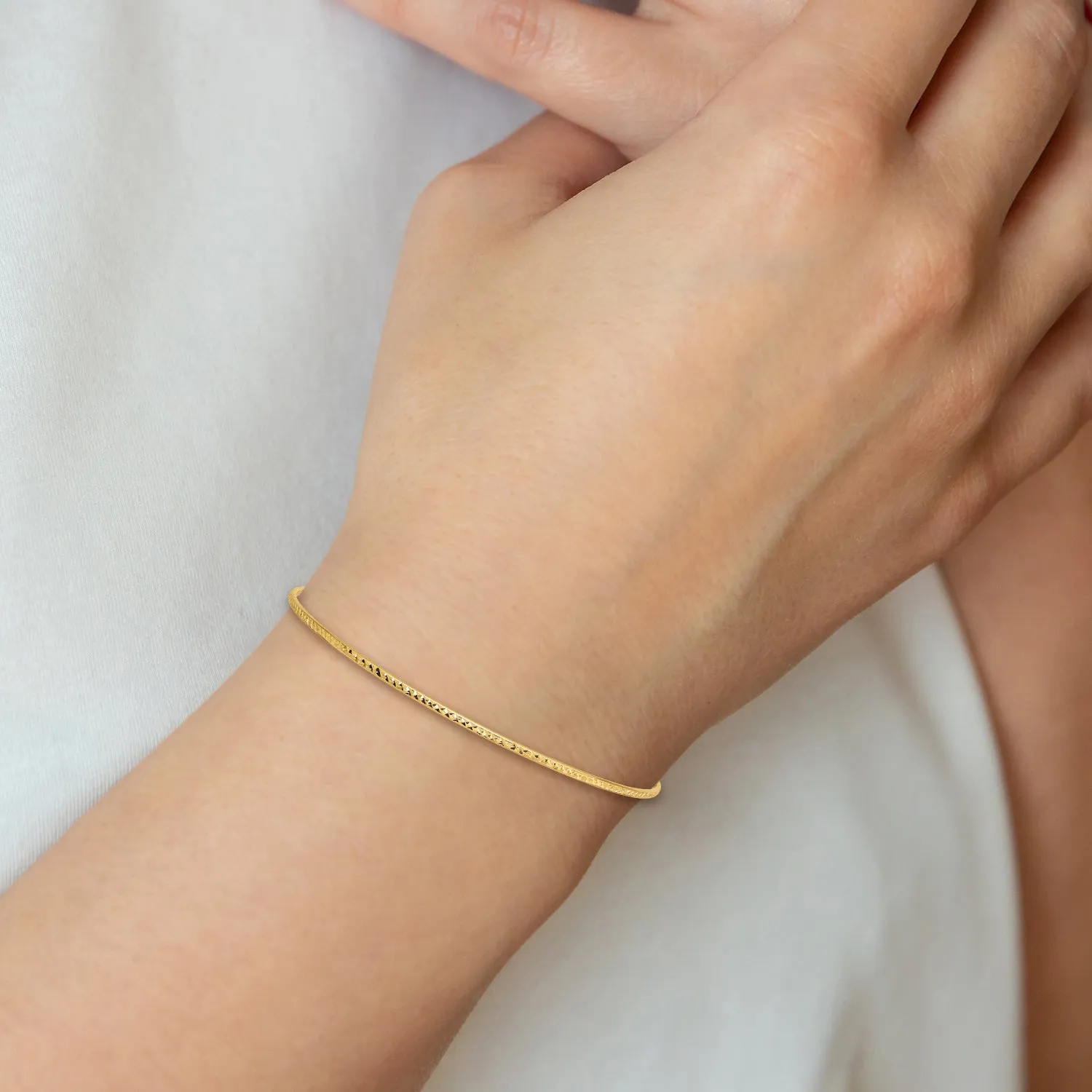 14K Gold Women's Diamond-Cut Bangle Bracelet with Polished Finish Elegant and Timeless Design