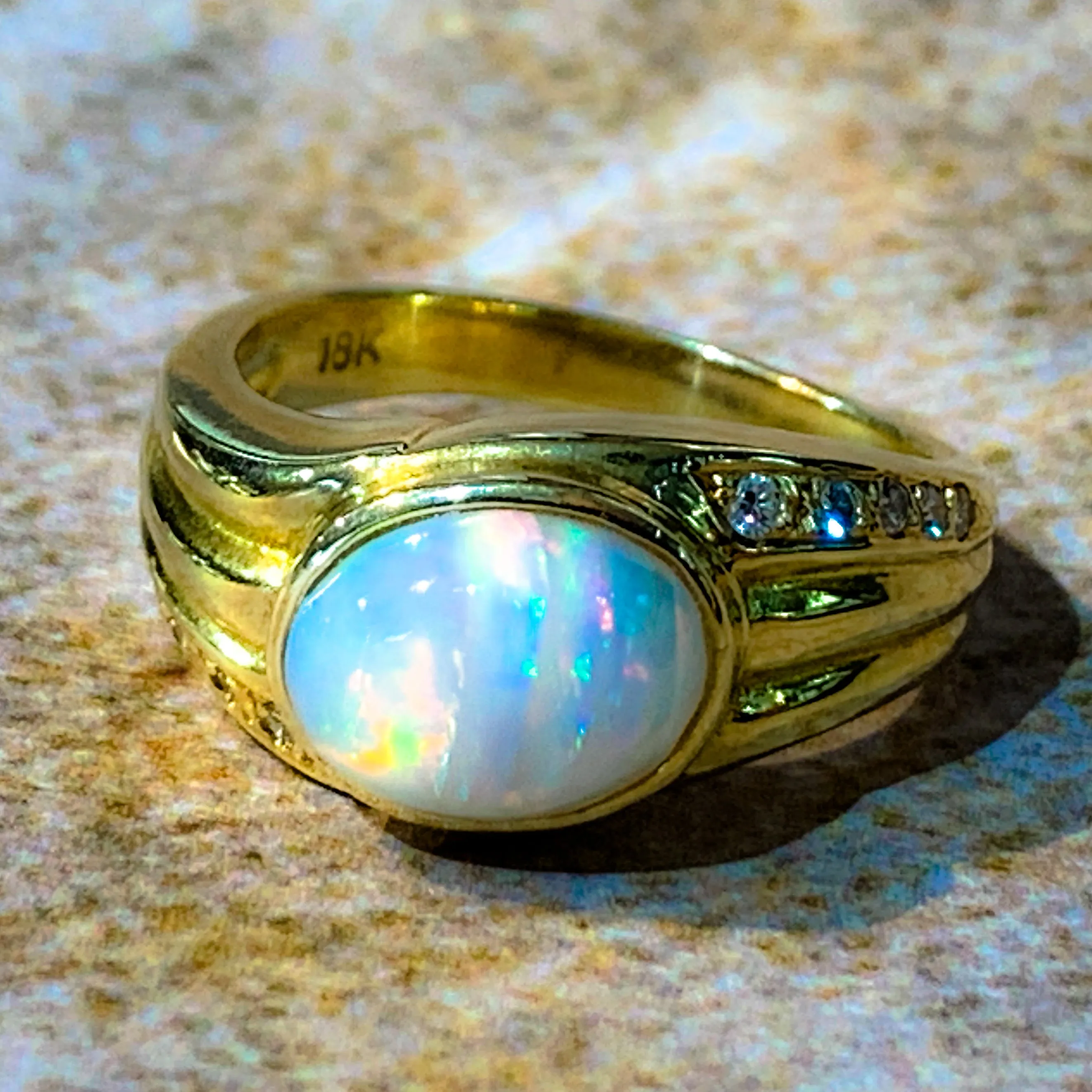 18kt Yellow Gold Multi colour Opal 9x7mm and Diamond ring