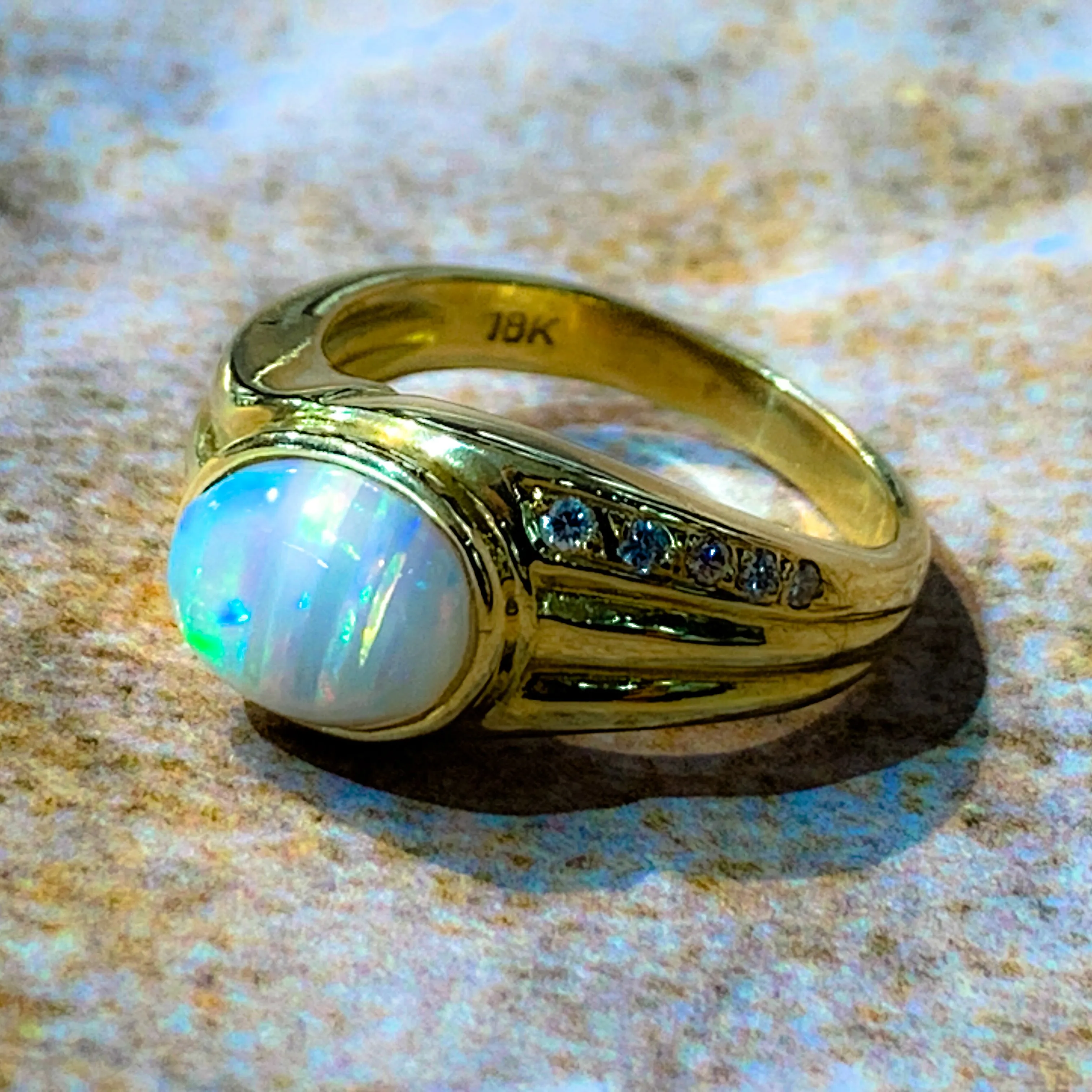 18kt Yellow Gold Multi colour Opal 9x7mm and Diamond ring